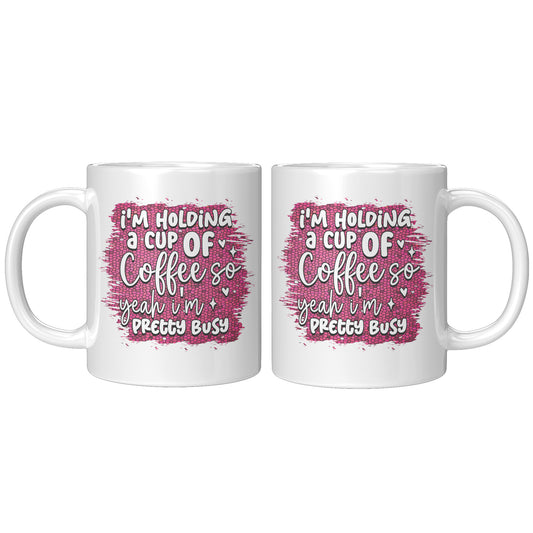 I'm holding a cup of coffee